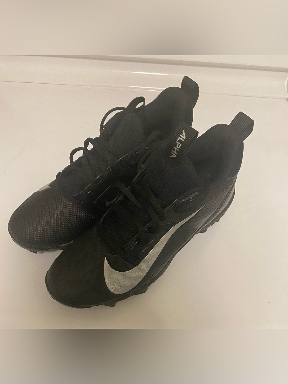 Nike Alpha Men's Black Athletic Sneakers with Silver Swoosh Accent